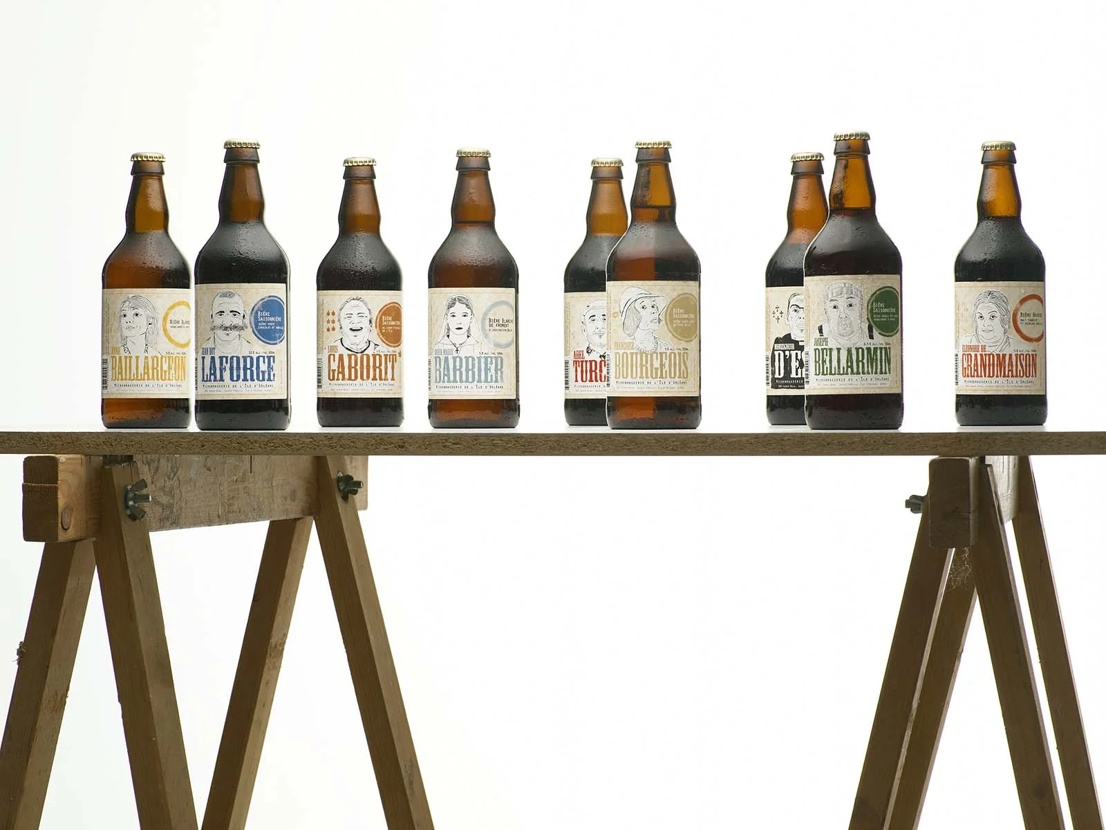 Maquette réaliste des différentes étiquettes de bières réalisées pour la nouvelle image de marque de la Microbrasserie de l’Île d'Orléans.